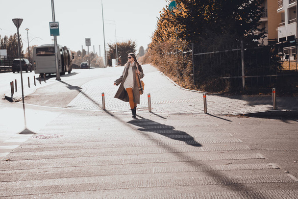 Full length photo of adorable nice lady dressed stylish comfortable cozy outfit move asphalt pathway curios look around outdoors. - Foto, imagen