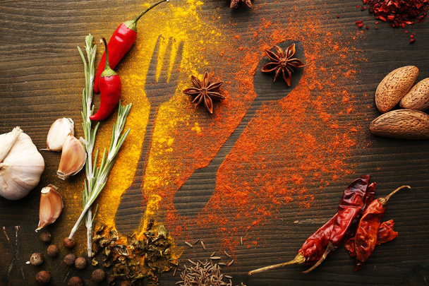 Spices on table with cutlery silhouette, close-up  - Foto, Bild