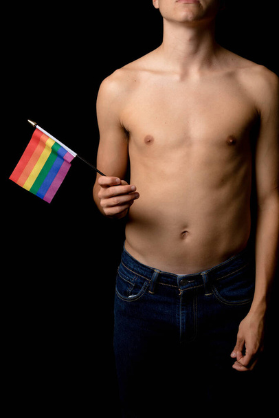 A Shirtless 19 Year Old Teenage Boy with Pride Flags - Фото, зображення