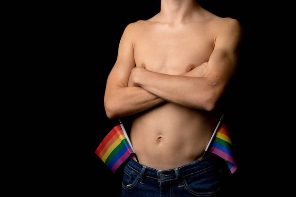 A Shirtless 19 Year Old Teenage Boy with Pride Flags - Photo, image