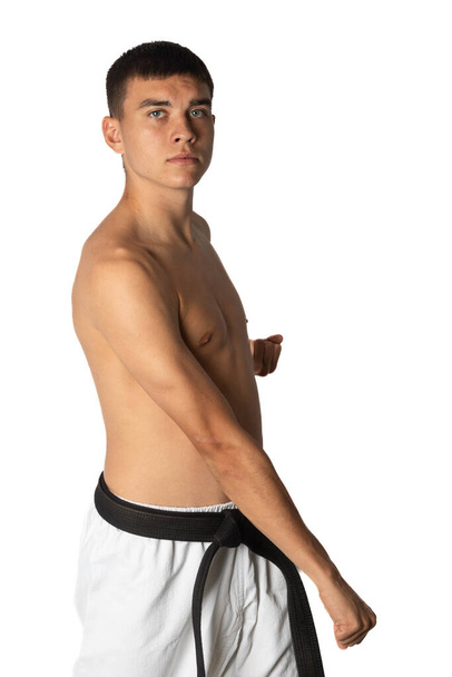 A Shirtless 19 Year Old Practacing a Karate Groin Block - Φωτογραφία, εικόνα