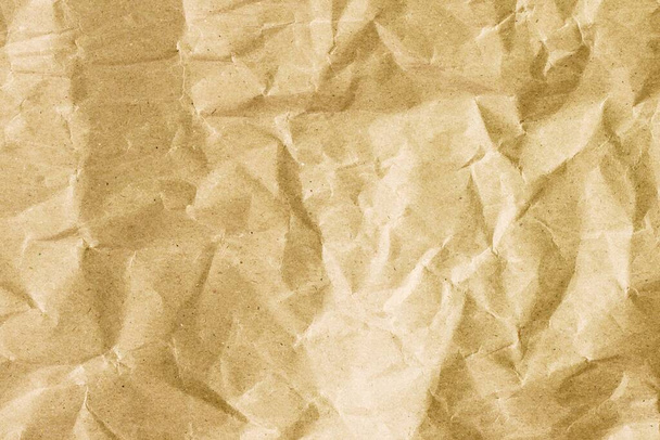 Textura de fondo de papel dorado arrugado. Fondo de papel arrugado marrón - Foto, imagen