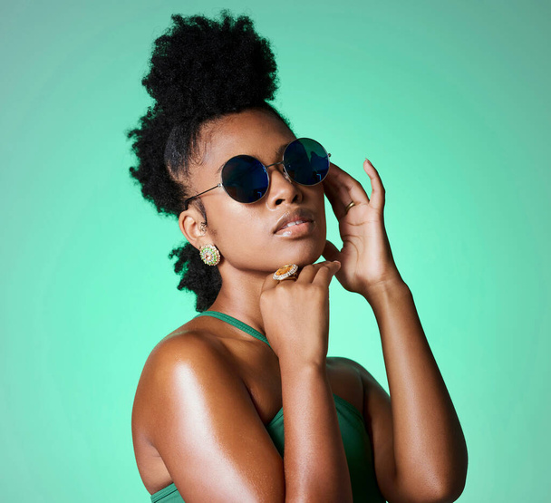 Fashion, beauty and retro black woman with sunglasses for vintage style, trend or eye protection. Face accessory, gen z and cool African girl or person with funky hairstyle, hipster shades and trendy. - Photo, Image