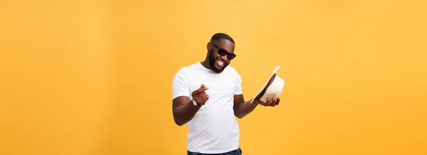 Young black man top dancing isolated on a yellow background - Foto, immagini