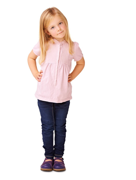Comfortable being herself. Cute little girl standing confidently against a white background - Foto, afbeelding
