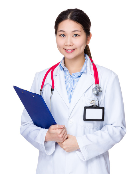 Female doctor with clipboard - Фото, изображение