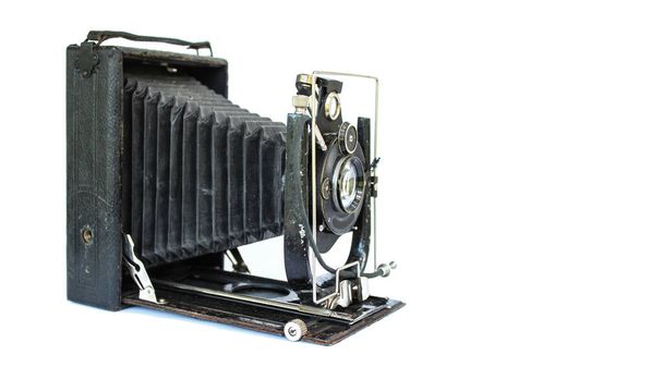 Old film camera from the 20s-30s of the 20th century on a white background. Rare camera on a white background. - Foto, Imagen
