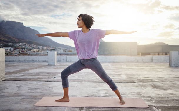 Stretching, yoga and pilates woman on roof outdoor for wellness, healthy and fitness lifestyle with sunshine lens flare. Exercise, workout and meditation sport girl training calm healing in city. - Fotoğraf, Görsel