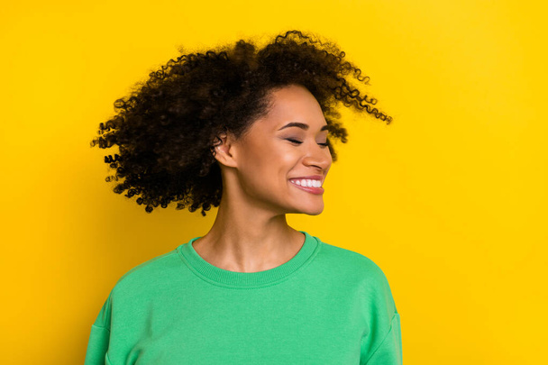 Portrait of carefree cheerful girl closed eyes turn head throw hair isolated on yellow color background. - Valokuva, kuva