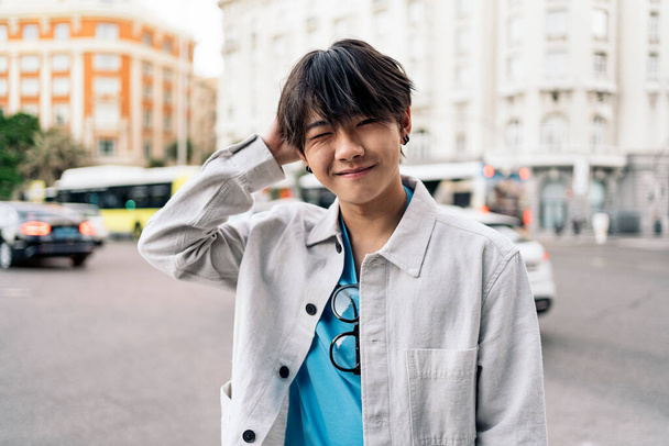 Cool asian man posing and looking at camera in the city of Madrid. - Fotografie, Obrázek