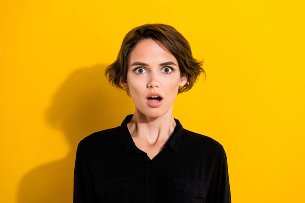 Photo of impressed millennial short hair lady wear black shirt isolated on yellow color background. - Φωτογραφία, εικόνα