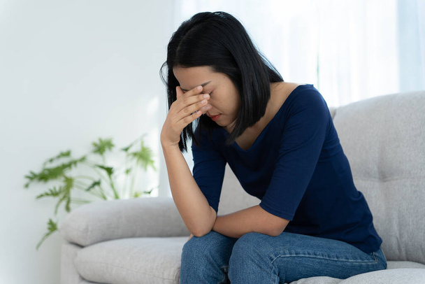 Depression and mental illness. Asian woman disappointed, sad after receiving bad news. Stressed girl confused with unhappy problems, arguing with boyfriend, cry and worry about unexpected pregnancy. - Fotó, kép