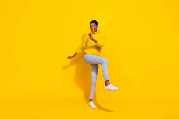 Full length body size view of attractive cheerful skinny girl dancing having fun good mood isolated over bright yellow color background. - Фото, зображення