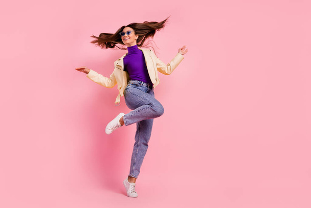 Full body photo of impressed brunette lady dance look promo wear casual cloth shoes glasses isolated on pink color background. - Фото, зображення