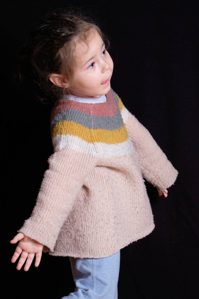 expressive baby girl showing her dance moves in the studio - Foto, immagini