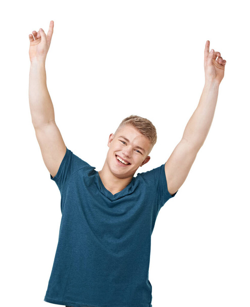 I did it. A young man pointing to the skies while isolated on a white background - Foto, imagen