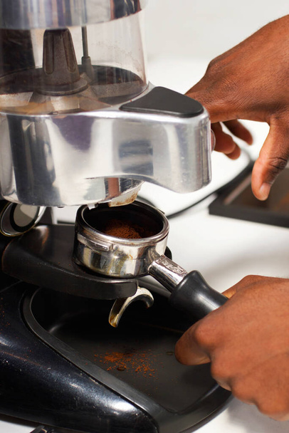 Roasted goodness. a barista preparing ground coffee for brewing - Photo, Image