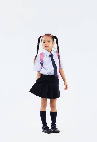Back to school, junior school student in british uniform full length on white background. - Valokuva, kuva