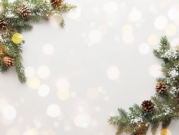 Beautiful Christmas tree branches on light background with space for text - Fotografie, Obrázek