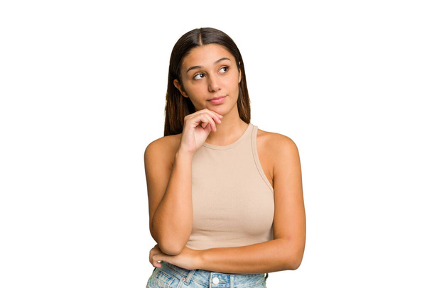 Young Indian woman isolated cutout removal background looking sideways with doubtful and skeptical expression. - Foto, Bild