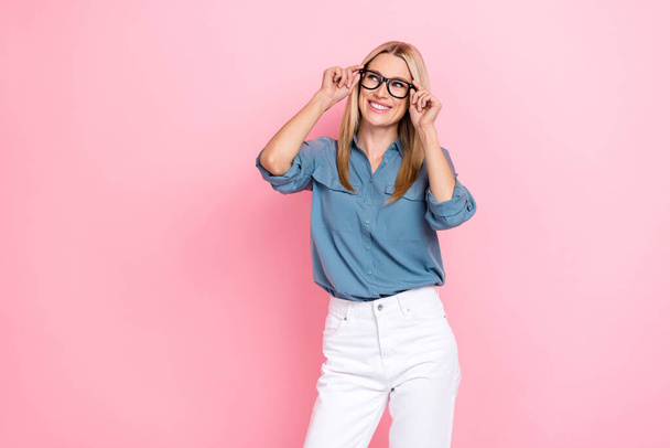 Photo of mature nice cute pretty business lady company owner choose new glasses specs positive dreamy look empty space deal isolated on pink color background. - Foto, immagini