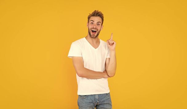 inspired with idea unshaven young man in white shirt on yellow background, inspiration. - Fotoğraf, Görsel