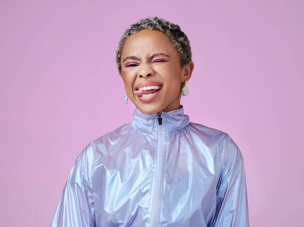Retro fashion, black woman and tongue out portrait, funny face or flirting in unique makeup, colorful neon and pink studio background. Crazy, bold and happy gen z influencer model in techno vaporwave. - Foto, Bild