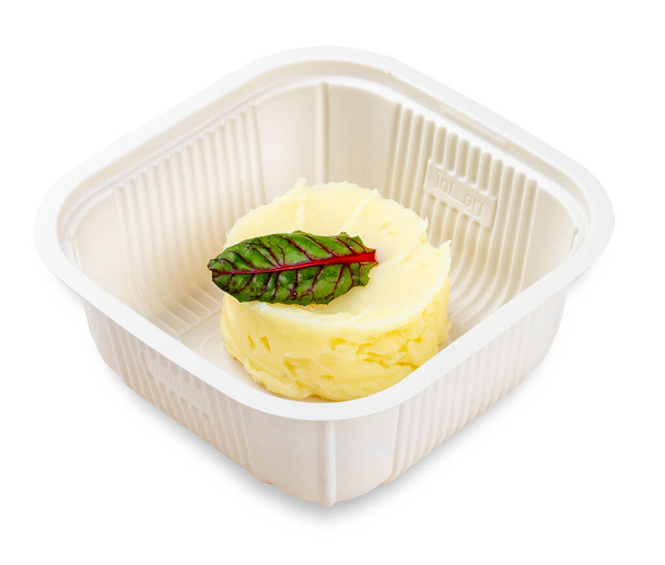 Mashed potatoes.  In a plastic container. Food to go. On a light background. - Foto, Imagem