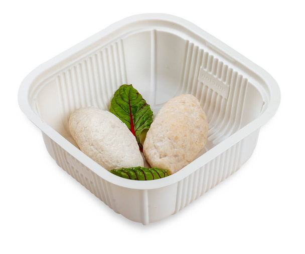 Steamed chicken cutlets. Diet food. In a plastic container. Food to go. On a light background. - Foto, Imagen