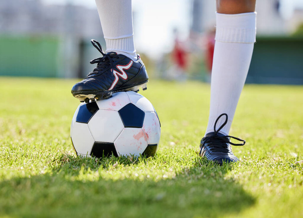 Soccer, ball and shoes of athlete on grass for training practice in fitness, sports and health. Motivation, exercise and workout with soccer player on football field for goals, wellness and games. - Photo, image
