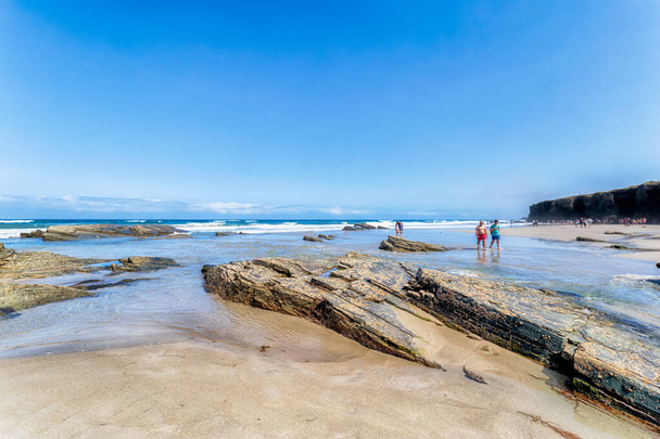 Ribadeo, Spain - August 21 2019: Cathedrals beach. Designated a Natural Monument, is one of the most famous beaches in Galicia. It is known around the world for its rocky formations carved by the wind and sea. - Fotó, kép