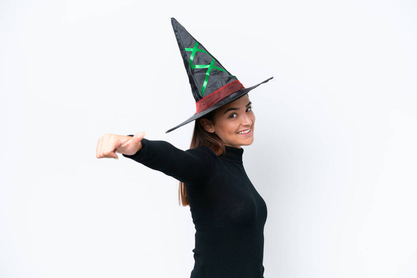 Young caucasian woman costume as witch isolated on white background giving a thumbs up gesture - Photo, Image