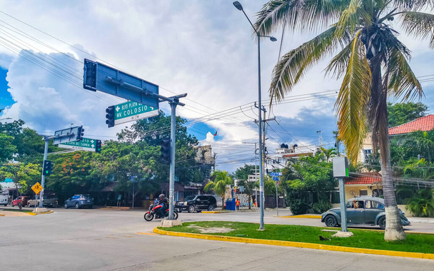 Playa del Carmen 07. September 2022 Typical street road and cityscape with cars traffic restaurants shops stores people and buildings of Playa del Carmen in Quintana Roo Mexico. - Fotografie, Obrázek