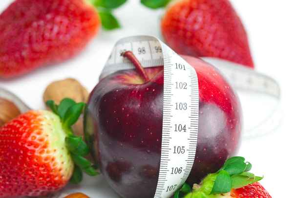 Apple,big juicy red ripe strawberries,nuts and measure tape isol - Фото, зображення