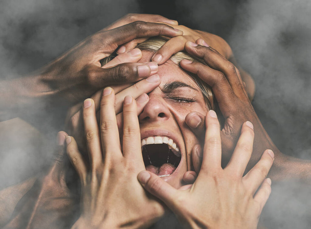 Hands, face and woman abuse victim with fear, mental health and pain scared with smoke. Crying, angry and violence survivor screaming in studio with dark background with stress, alone and anxiety - Photo, Image