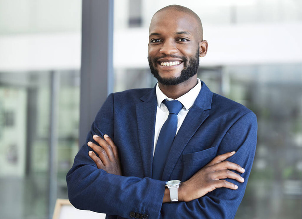 Leadership, management and arms crossed with businessman in office for executive, success and vision. Smile, innovation and goals with professional black man employee working in corporate company. - Foto, immagini