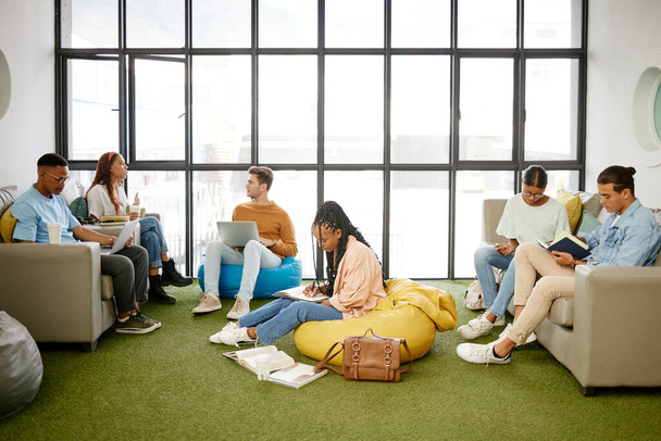 Education, studying and students meeting for project collaboration, teamwork or research planning in university workspace. Design, creativity and relax gen z group of people in college study team. - 写真・画像