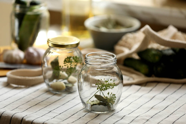 Empty glass jars and ingredients prepared for canning on table - Fotoğraf, Görsel