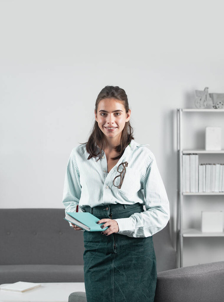 Female student or young teacher girl. Business woman entrepreneur working in office, professional employee at workplace. Young beautiful secretary girl - Fotoğraf, Görsel