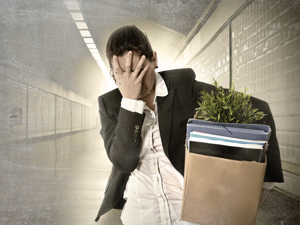 Sad depressed businesswoman carrying cardboard box fired from Job - Photo, Image