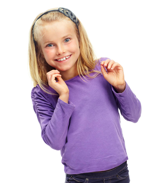 Looking forward to the holidays. Sweet little blonde girl posing happily against a white background - Photo, Image