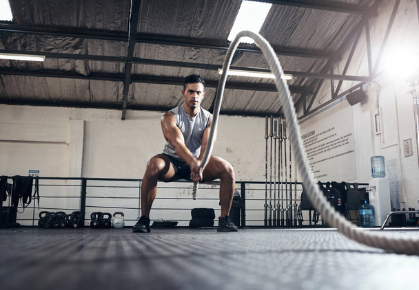 Man, workout and fitness with rope at gym for health, exercise and body wellness. Healthy, muscle and strong for development for athlete in mma, wrestling or sport at training club, class or studio. - Φωτογραφία, εικόνα