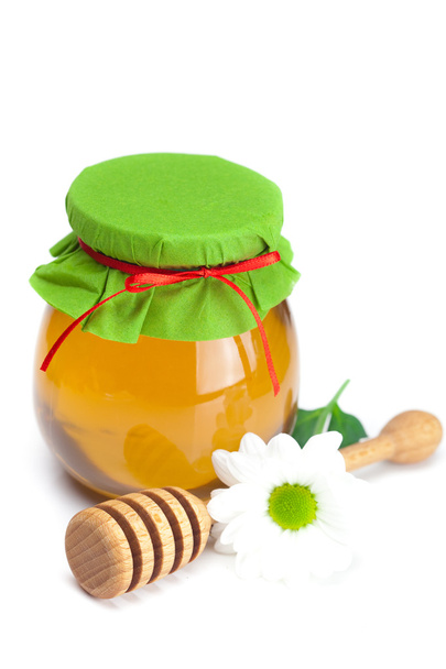 Stick to hohey ,flower and jar of honey isolated on white - Photo, image