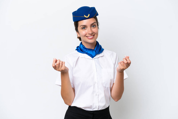 Avion hôtesse femme caucasienne isolé sur fond blanc faire geste d'argent - Photo, image
