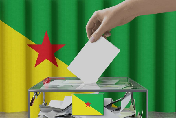 French Guiana flag, hand dropping ballot card into a box - voting/ election concept - 3D illustration - Photo, Image