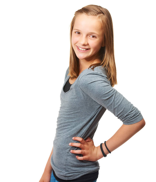 Posing with confidence. Studio portrait of a young teenage girl standing against a white background - Foto, Imagem