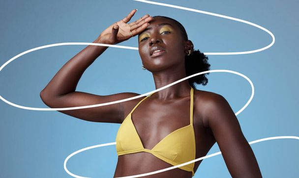 Beauty, fashion and makeup with a black woman in studio on a blue background with pattern. Style, cosmetics and design with an attractive young female posing in trendy or contemporary clothes. - Fotó, kép