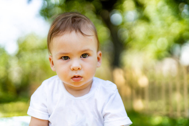 Cute funny kid with blur background. Portrait of happy little boy. - Zdjęcie, obraz