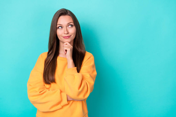 Photo of young adorable pretty attractive nice cute woman touch chin dreamy look empty space information news isolated on cyan color background. - Valokuva, kuva