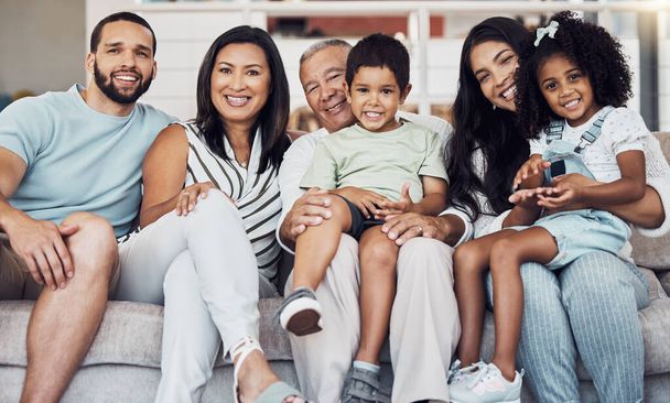 Family, sofa and happy in living room in portrait together in home or on vacation. Children, parents and grandparents love, happiness and smile while on holiday, in hotel or house in Houston, Texas. - 写真・画像
